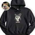 The Portrait Hoodie in Black with a portrait of a corgi and the name Biscuit