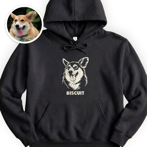 The Portrait Hoodie in Black with a portrait of a corgi and the name Biscuit