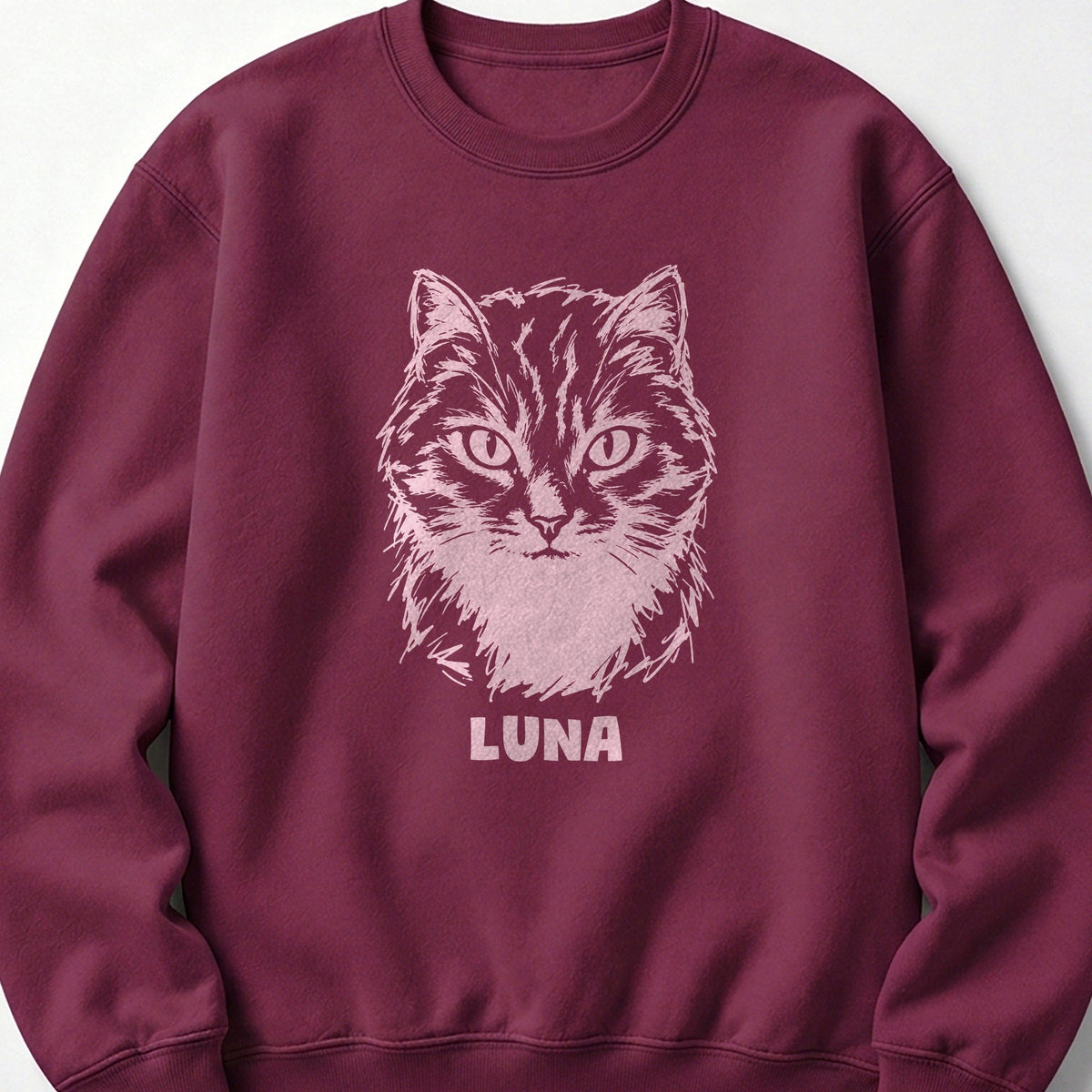 The Portrait Crewneck in Maroon with a portrait of a tabby cat and the name Luna