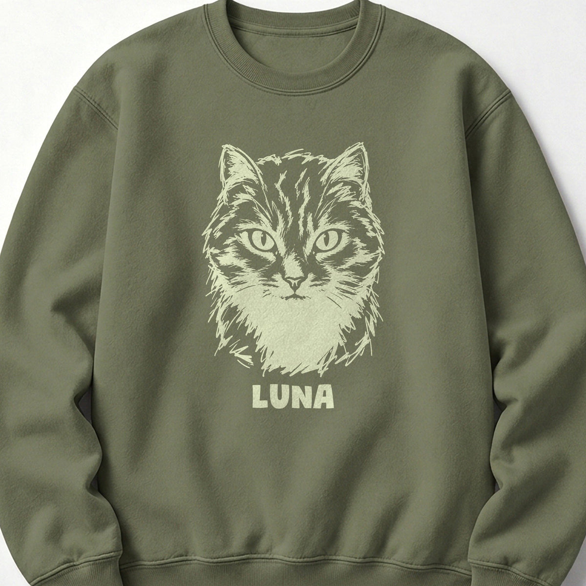 The Portrait Crewneck in Military Green with a portrait of a tabby cat and the name Luna