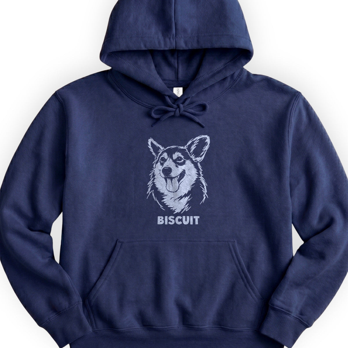 The Portrait Hoodie in Navy with a portrait of a corgi and the name Biscuit